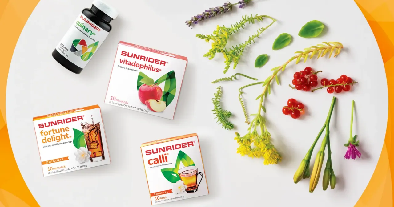 Four Sunrider packs on a white plate among botanicals, on orange